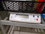 an image of a scale on a shelf in a kitchen