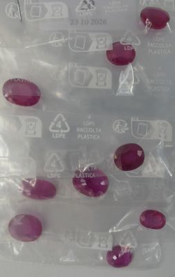 a plastic bag with a bunch of buttons in it