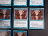 several cards of different characters are displayed on a black surface