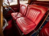 a red leather seat in the back of a car