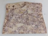 a piece of marble on a white surface