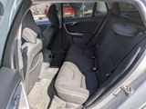 the back seats of a car are empty in a parking lot
