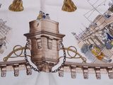 a picture of a table cloth with a picture of a castle on it