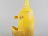 an image of a yellow teapot shaped like a banana
