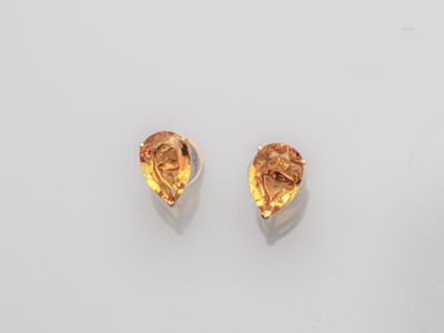 a pair of citrine quartz earrings on a white surface