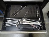 a drawer full of wrenches and other tools in it