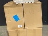 boxes of toilet paper stacked on top of each other on a pallet