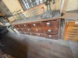 a lot of drawers and filing cabinets in this room