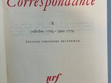 an open book with red writing on it sitting on a table