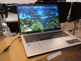 a laptop computer sitting on top of a box on a table
