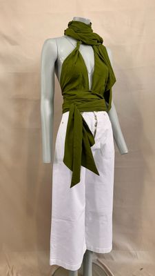 an image of a mannequin wearing a green top and white pants