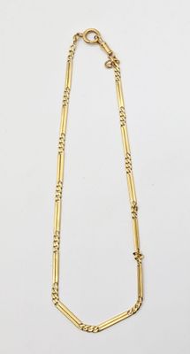 a gold necklace with a long chain and a clasp