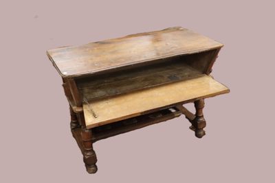 a small wooden table with two shelves on it