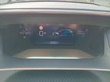 the dashboard of a car with a digital display in the center