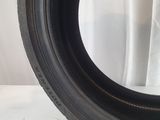 a close up of a tire on a white surface