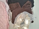 three pairs of shoes, a sweater, and a pair of shoes