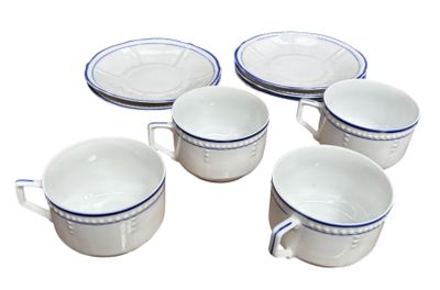six white and blue coffee cups and saucers sitting on a white surface