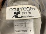 the label on the back of a grey jacket that says courreges paris