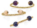 a set of three gold - plated bracelets with lapis and garnets