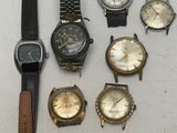 a lot of watches that are sitting on a table