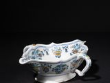 a blue and white porcelain bowl with a floral design on it