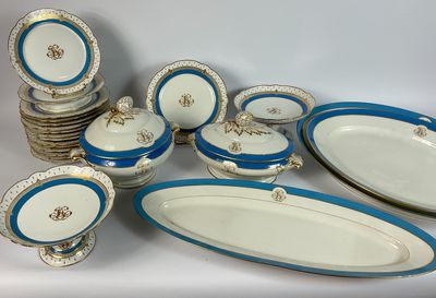 a lot of blue and white plates and bowls on a table