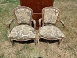 two chairs that are sitting in the grass