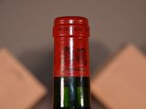 a bottle of wine that is sitting on a table