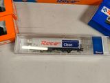 many different types of toy trains on the table