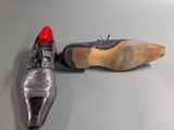 a pair of shoes sitting on the floor next to each other