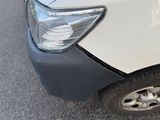 a close up of a white truck with a black stripe