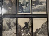 several black and white photographs of rocks and water in a room