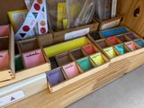 a wooden box filled with lots of different types of cards