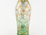 a glass vase with a floral design on it