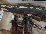 a wooden object that is on display in a case