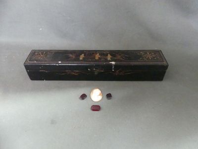 a small box with a candle inside of it on a table