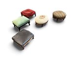 four small stools and a small ottoman on a white surface