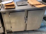 a kitchen with a stainless steel counter top and a metal oven