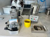 a blender that is sitting on a counter with a yellow cup