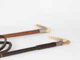 pair of antique canes and a cane cane with a wooden handle