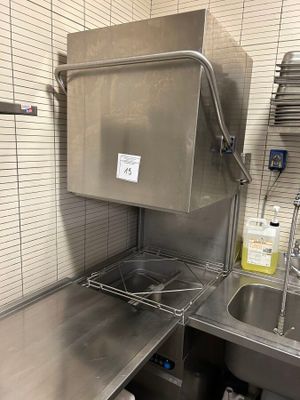 a kitchen with a sink and a dishwasher in it