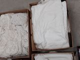 several boxes of clothing are sitting on the floor next to each other