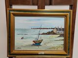 a picture of a painting on a easel next to a chair