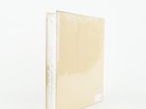 the cover of a book is covered in a clear plastic sheet