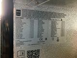 a close up of a metal door with a qr code on it