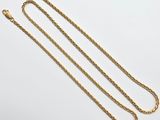 a gold chain with a clasp on a white background