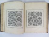an open book with a pattern on the inside of it