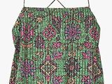 a green and pink top with a floral pattern on it