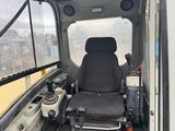 a seat in the back of a bus with a glass floor