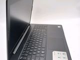 a laptop with a black keyboard on a white surface